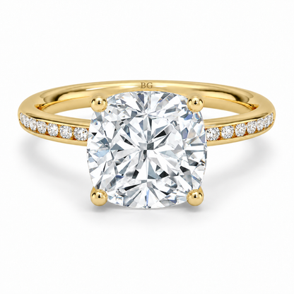 Cushion cut lab grown diamond solitaire ring with channel set band in yellow gold