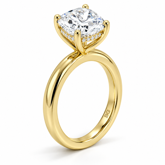 Cushion cut lab grown diamond hidden halo engagement ring with plain band in yellow gold