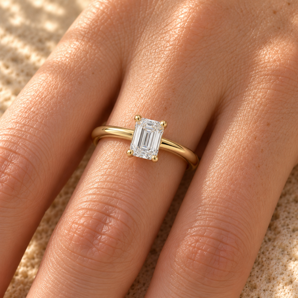 Emerald cut lab grown diamond cathedral ring worn on hand, yellow gold