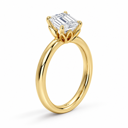 Emerald cut lab grown diamond solitaire engagement ring with lotus basket and plain band in yellow gold