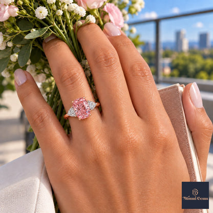 Pink Elongated Cushion Cut Lab Grown Diamond Engagement Ring - Trillion Three Stone in rose gold, worn on the hand