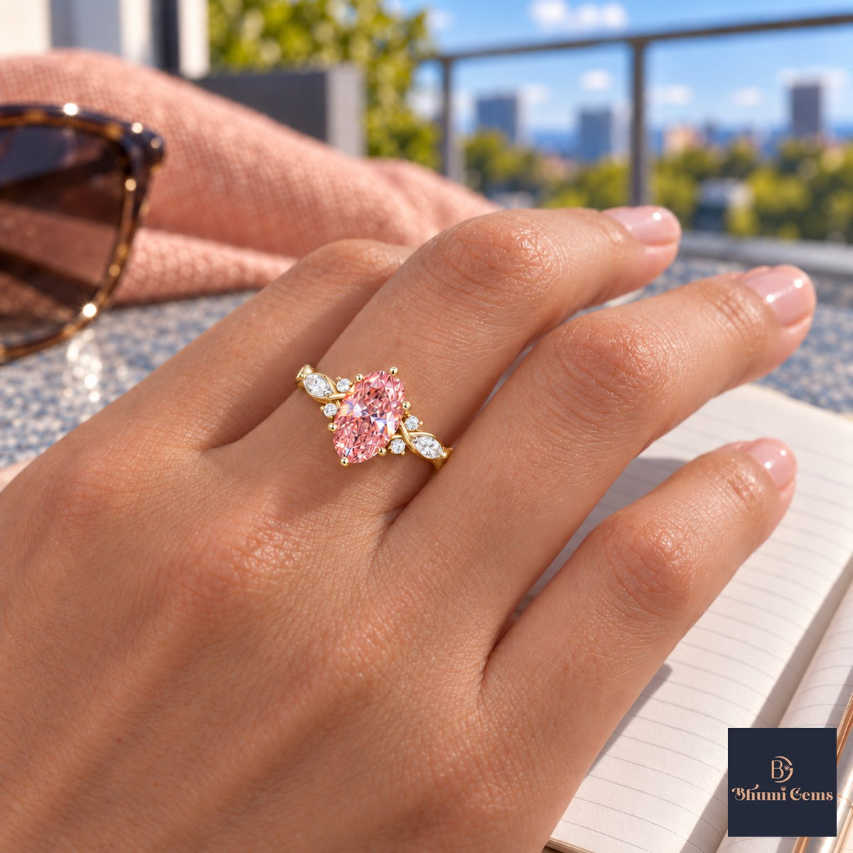 Pink Oval Cut Lab Grown Diamond Engagement Ring - Leaf Cluster Shoulders in yellow gold, worn on the hand