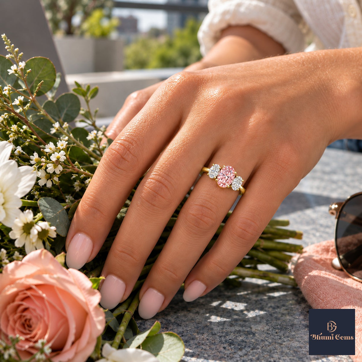 Pink Oval Cut Lab Grown Diamond Engagement Ring - Oval Three Stone in yellow gold, worn on the hand