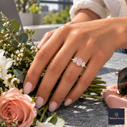 Pink Oval Cut Lab Grown Diamond Engagement Ring - Oval Three Stone in yellow gold, worn on the hand