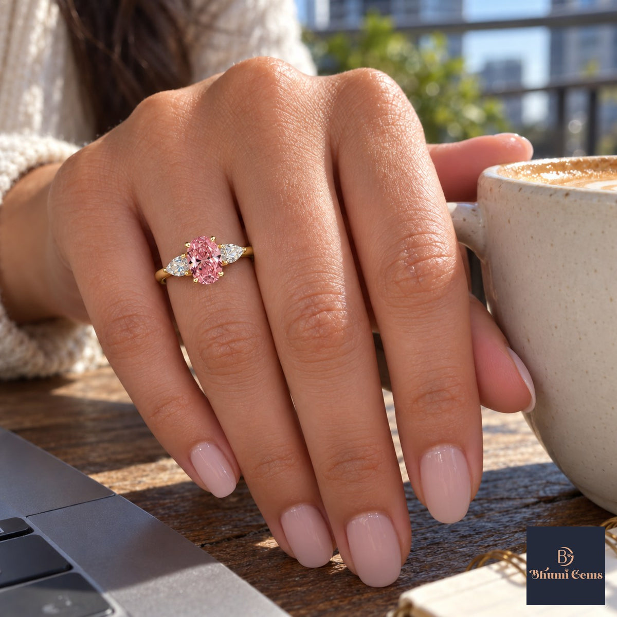 Pink Oval Cut Lab Grown Diamond Engagement Ring - Pear Side Stones in yellow gold, on the hand