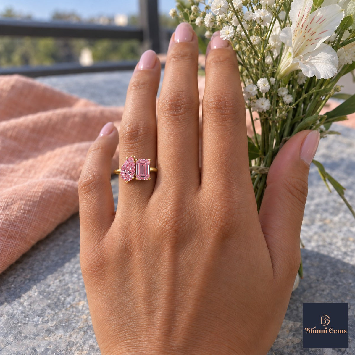 Pink Pear and Emerald Cut Lab Grown Diamond Engagement Ring - Toi et Moi in yellow gold, worn on the hand