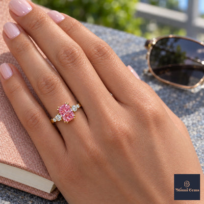 Pink Radiant Cut Lab Grown Diamond Engagement Ring - Round Accents in yellow gold, worn on the hand