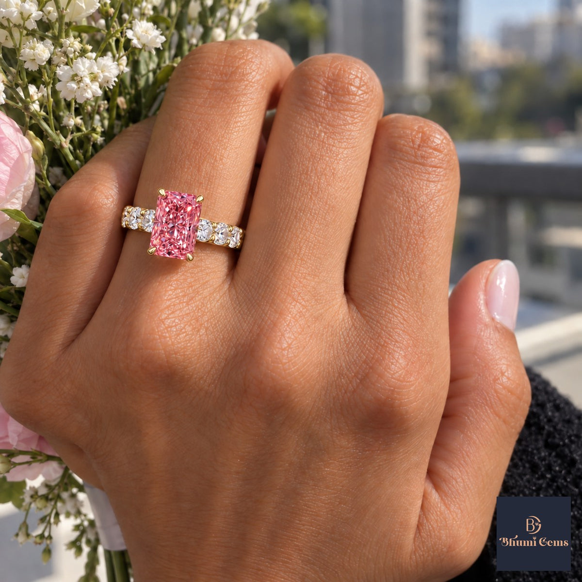 Pink Radiant Cut Lab Grown Diamond Engagement Ring - Shared Prong Band in yellow gold, worn on the hand