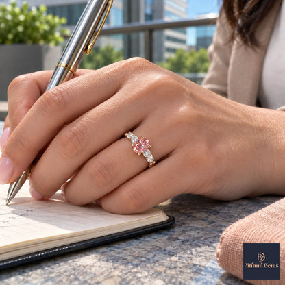 Pink Round Cut Lab Grown Diamond Engagement Ring - Marquise and Round Station Band in rose gold, on the hand