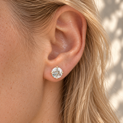 Round Moissanite Stud Earrings - Yellow gold - worn on the ear