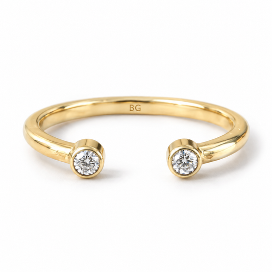 Round cut two stone moissanite open cuff band in yellow gold