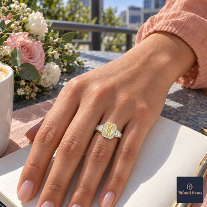 Yellow Emerald Cut Lab Grown Diamond Engagement Ring - Halo and Baguette Shoulders in yellow gold, worn on the hand