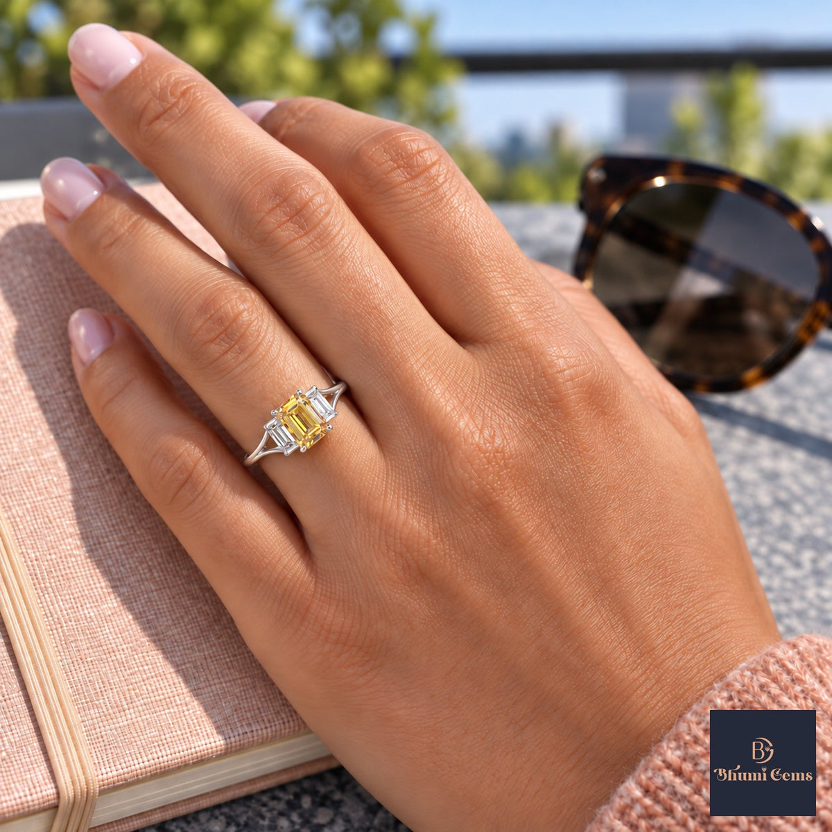 Yellow Emerald Cut Lab Grown Diamond Engagement Ring - Trapezoid Three Stone in white gold, worn on the hand