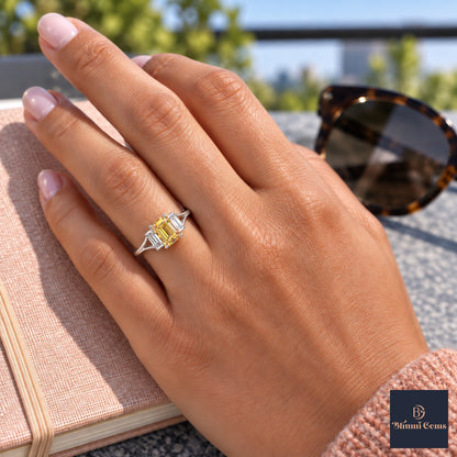 Yellow Emerald Cut Lab Grown Diamond Engagement Ring - Trapezoid Three Stone in white gold, worn on the hand