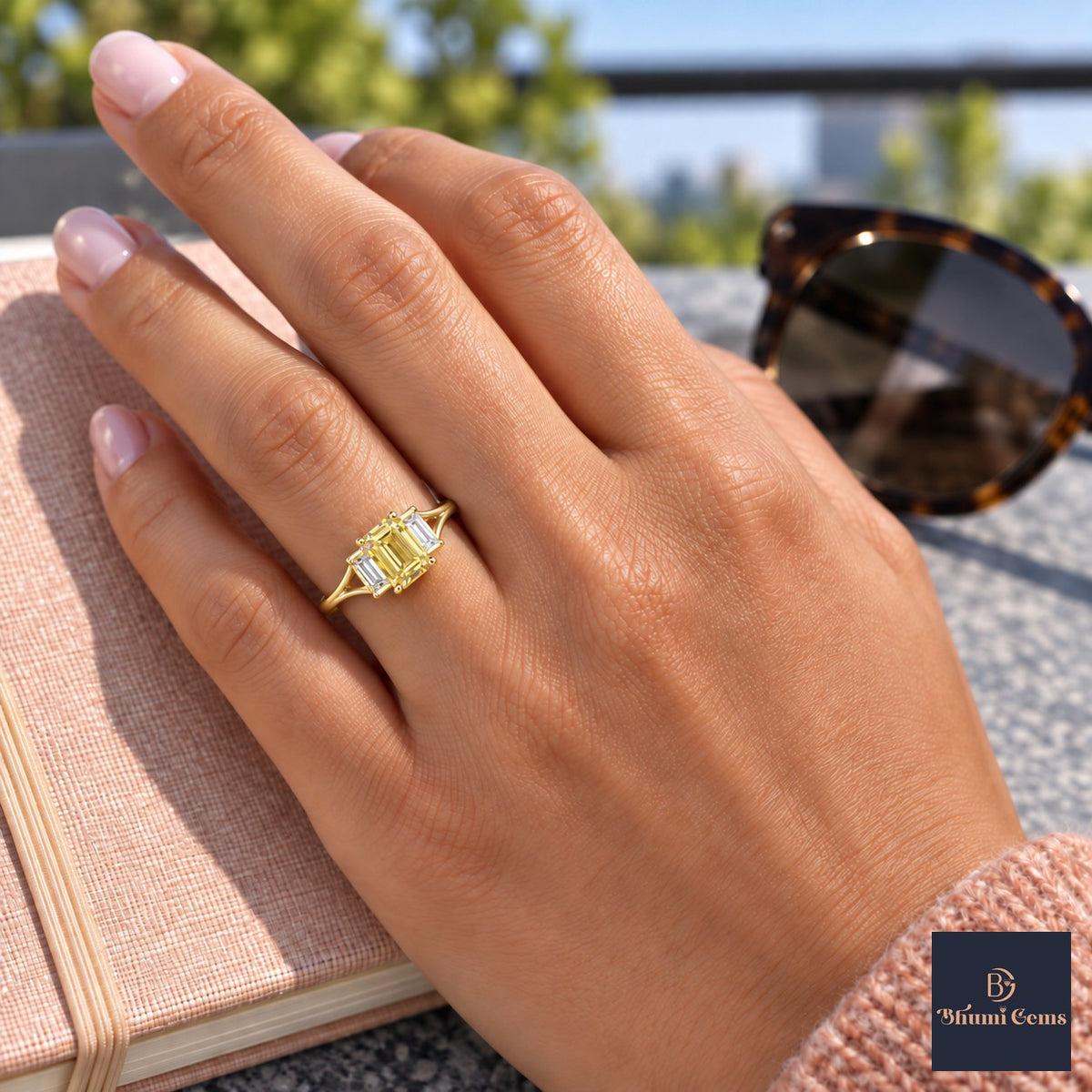 Yellow Emerald Cut Lab Grown Diamond Engagement Ring - Trapezoid Three Stone in yellow gold, worn on the hand