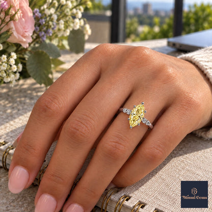 Yellow Marquise Cut Lab Grown Diamond Engagement Ring - Round Accents in white gold, worn on the hand