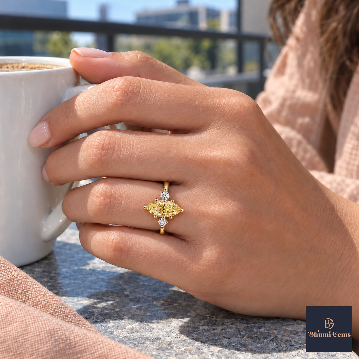 Yellow Marquise Cut Lab Grown Diamond Engagement Ring - Three Stone in yellow gold, worn on the hand
