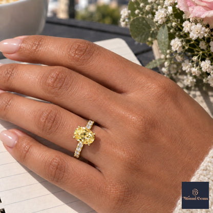 Yellow Oval Cut Lab Grown Diamond Engagement Ring - Cathedral Pave Band in yellow gold, worn on the hand