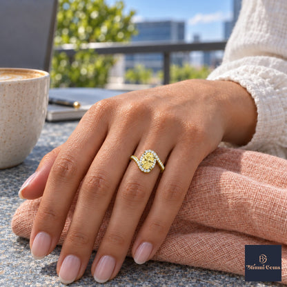 Yellow Oval Cut Lab Grown Diamond Engagement Ring - Halo Bypass in yellow gold, on the hand
