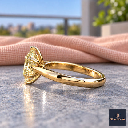 Yellow Oval Cut Lab Grown Diamond Engagement Ring - Heart Prong Solitaire in yellow gold, side view