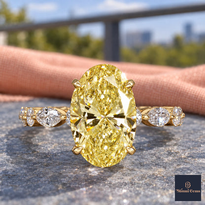 Yellow Oval Cut Lab Grown Diamond Engagement Ring - Navette Band in yellow gold, close-up