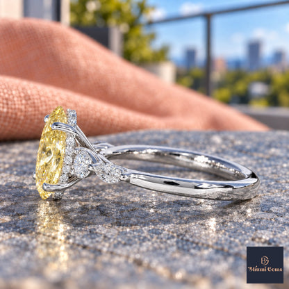 Yellow Oval Cut Lab Grown Diamond Engagement Ring - Round and Marquise Accents in white gold, side view