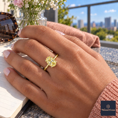 Yellow Oval Cut Lab Grown Diamond Engagement Ring - Six Prong Solitaire in yellow gold, worn on the hand