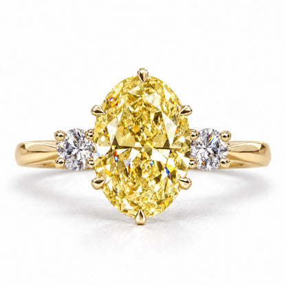 Yellow Oval Cut Lab Grown Diamond Engagement Ring - Three Stone in yellow gold, front view