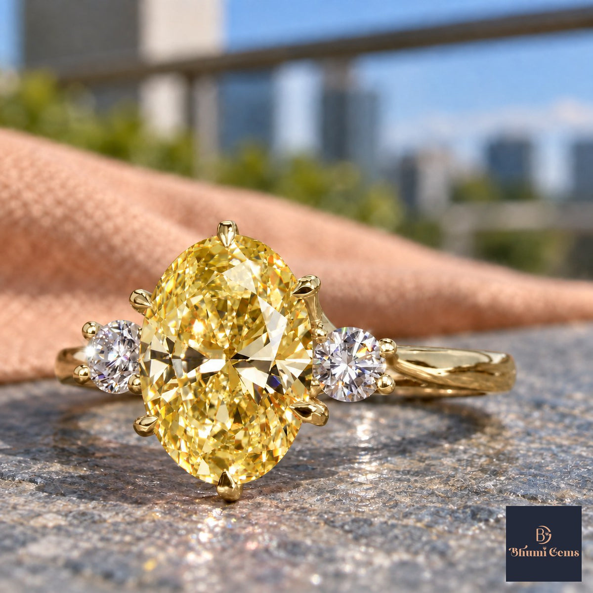 Yellow Oval Cut Lab Grown Diamond Engagement Ring - Three Stone in yellow gold, close-up