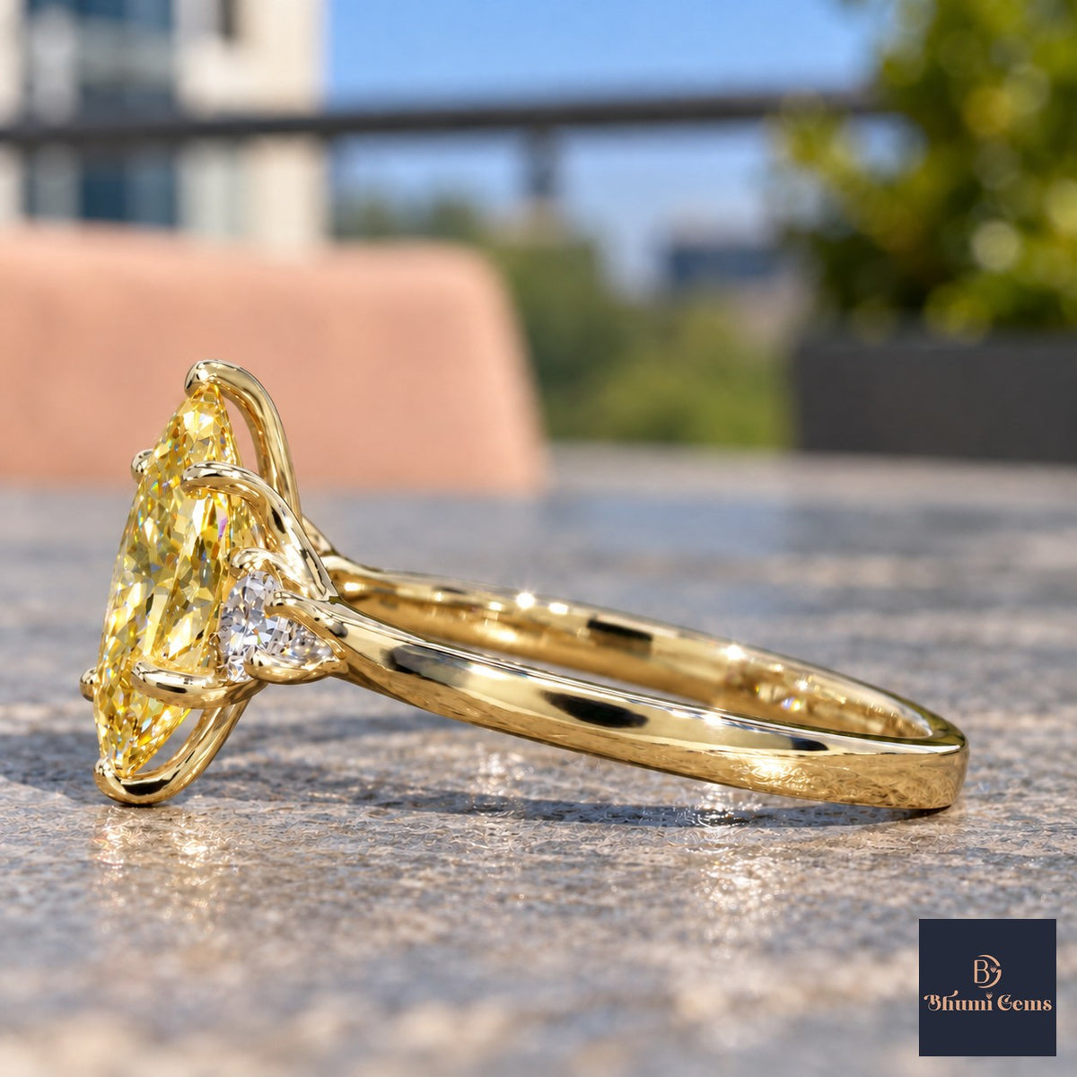 Yellow Oval Cut Lab Grown Diamond Engagement Ring - Three Stone in yellow gold, side view