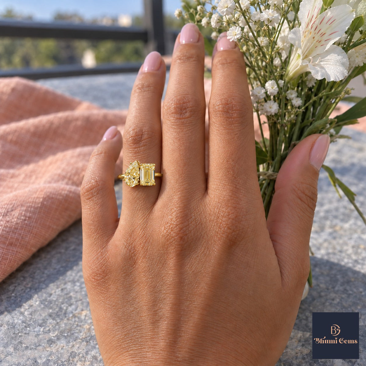 Yellow Pear and Emerald Cut Lab Grown Diamond Engagement Ring - Toi et Moi in yellow gold, worn on the hand