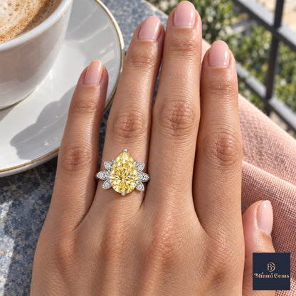 Yellow Pear Cut Lab Grown Diamond Engagement Ring - Floral Leaf Accents in white gold, on the hand