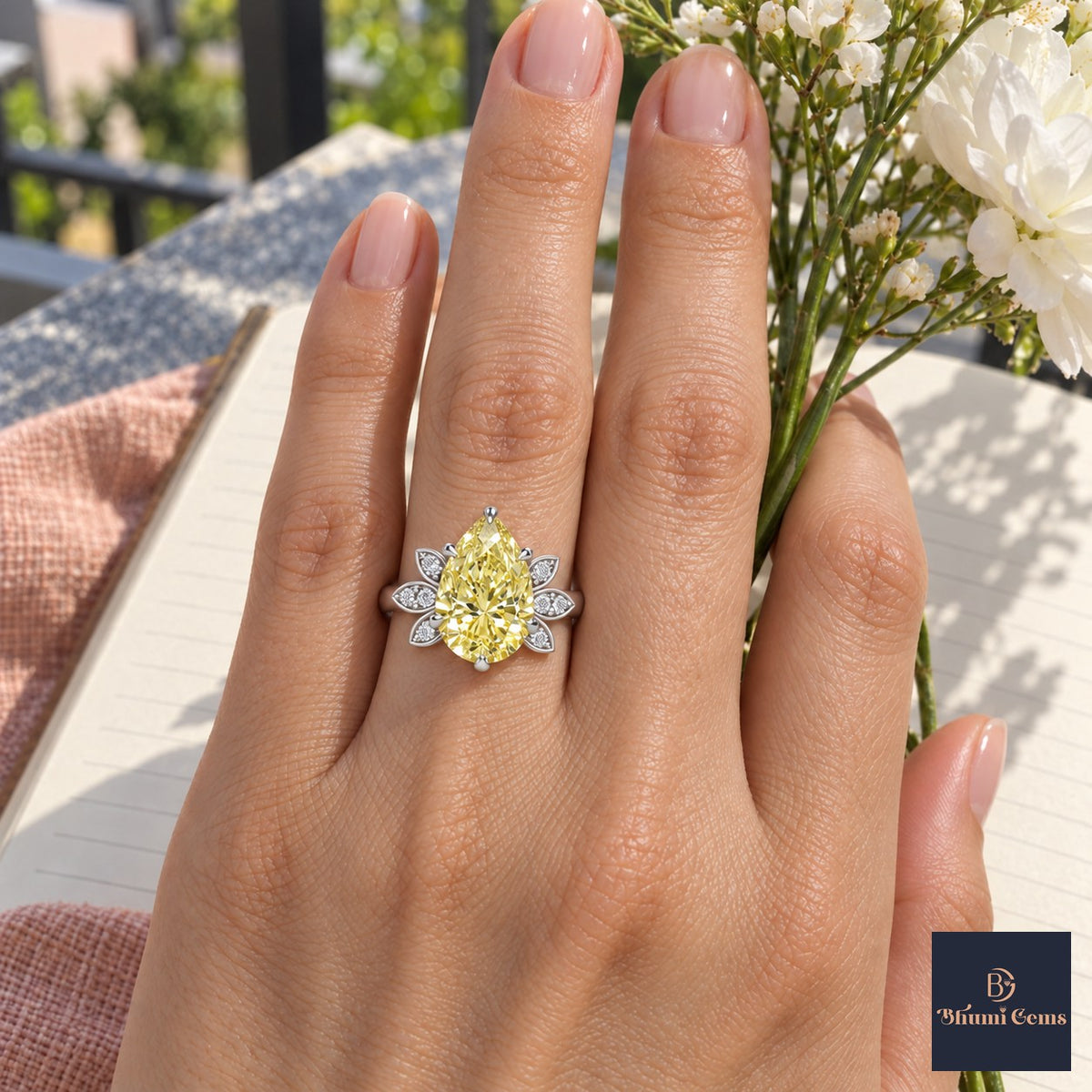 Yellow Pear Cut Lab Grown Diamond Engagement Ring - Floral Leaf Accents in white gold, worn on the hand