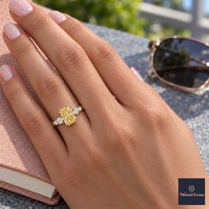 Yellow Radiant Cut Lab Grown Diamond Engagement Ring - Round Accents in yellow gold, worn on the hand