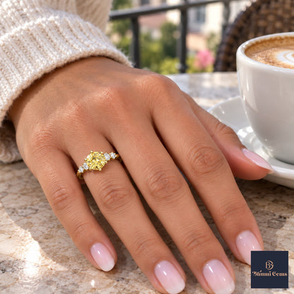 Yellow Round Cut Lab Grown Diamond Engagement Ring - Cluster Shoulders in yellow gold, on the hand