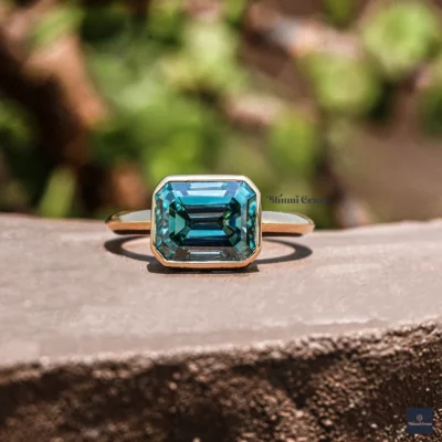 Blue Colored Emerald Moissanite Engagement Ring East-West